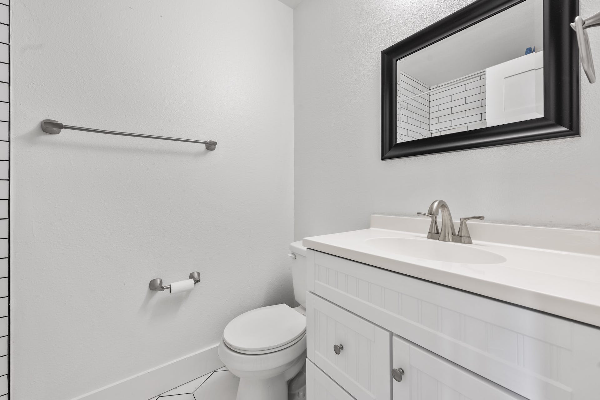 1400 Chippeway Lane Austin, TX 78745 - Photo 18 of 24 Bathroom featuring vanity and tile patterned floors