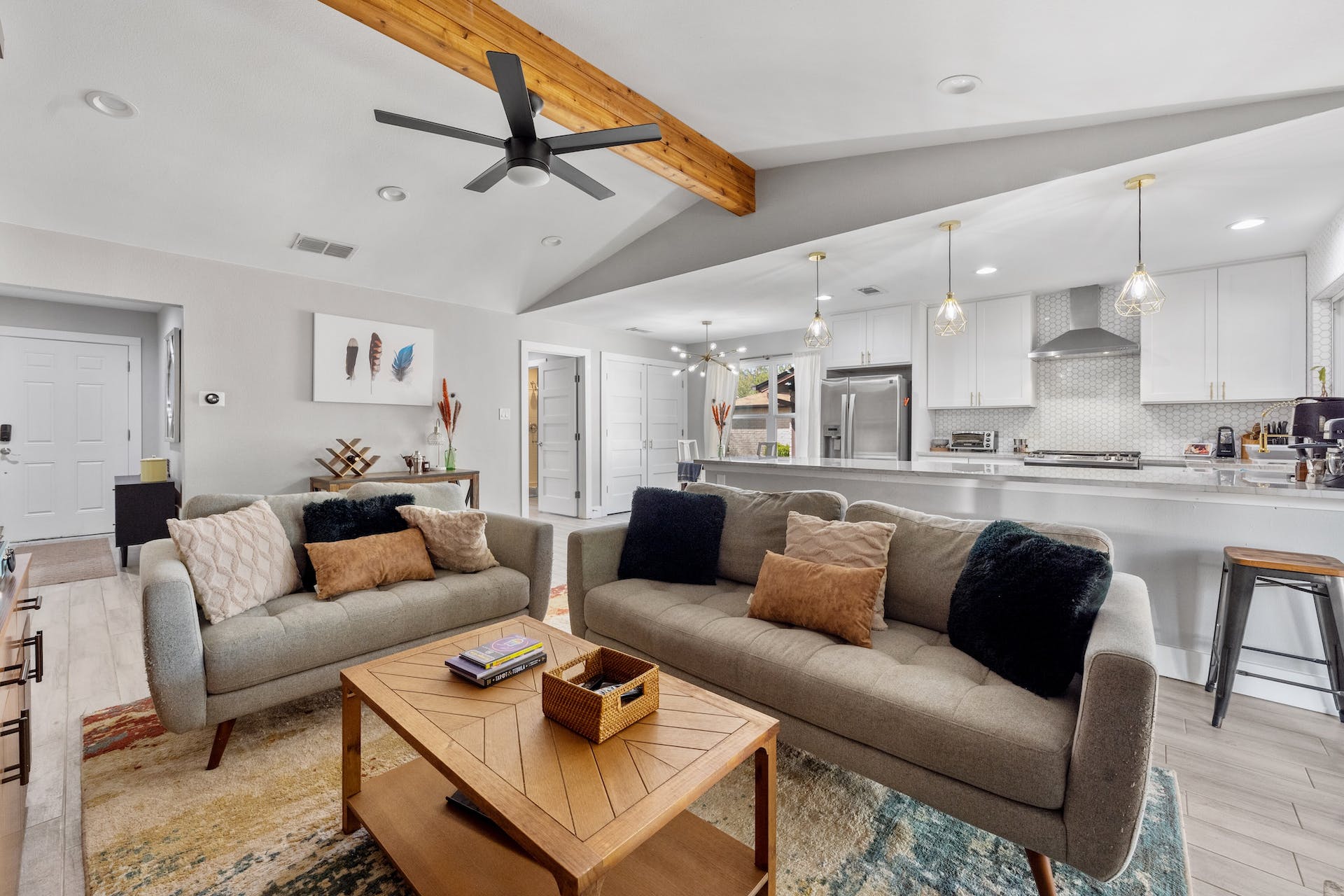 1400 Chippeway Lane Austin, TX 78745 - Photo 4 of 24 Living room with light wood-style flooring, beamed ceiling, a ceiling fan, and recessed lighting