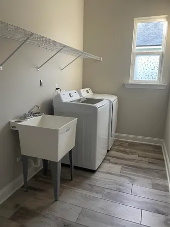 a utility room with washer and dryer