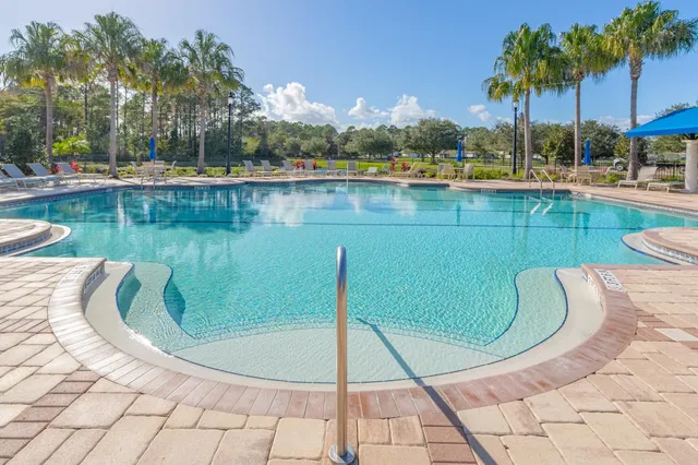 a view of a swimming pool with a lake view