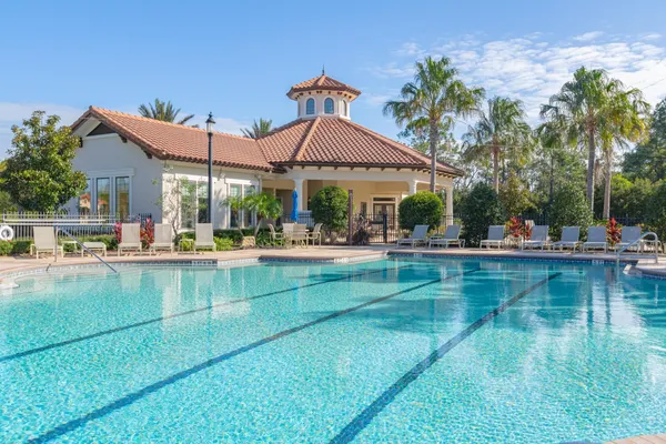 a view of a swimming pool with chairs