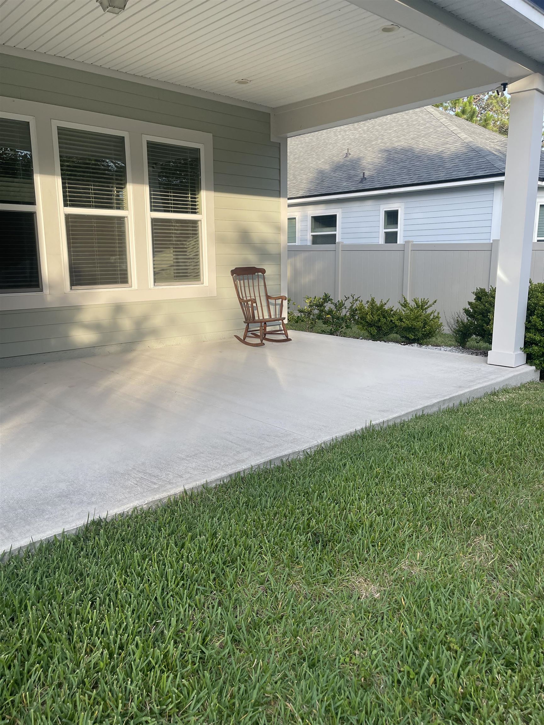 198 Paranza Trace St. Augustine, FL 32095 - Photo 19 of 23 a front view of house with yard and trees in the background