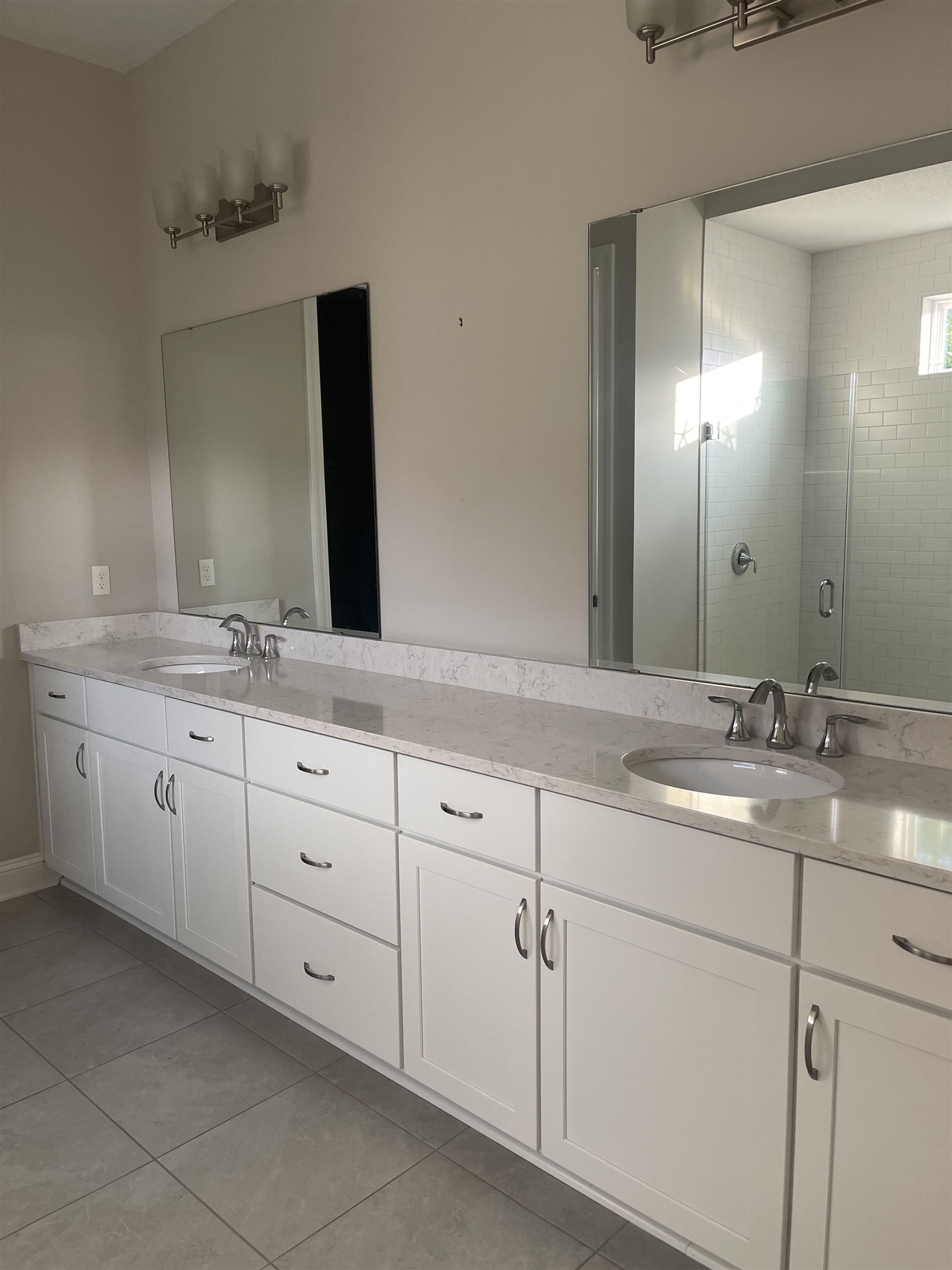 198 Paranza Trace St. Augustine, FL 32095 - Photo 9 of 23 a bathroom with a granite countertop sink double and mirror