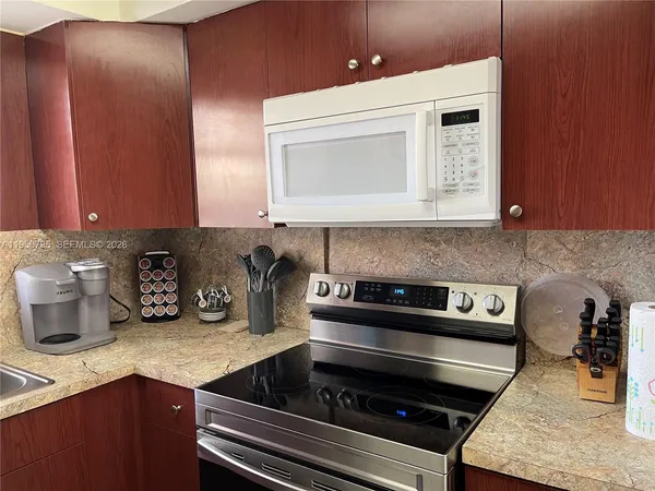 a kitchen with a stove and a microwave