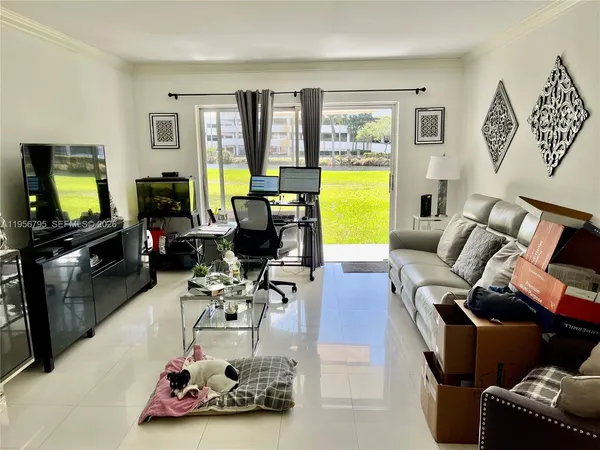 a room with furniture and a flat screen tv