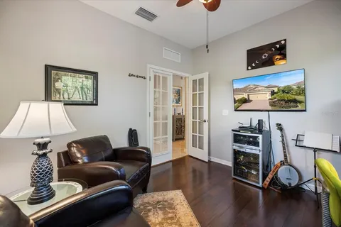 an aerial view of residential houses with outdoor space and parking