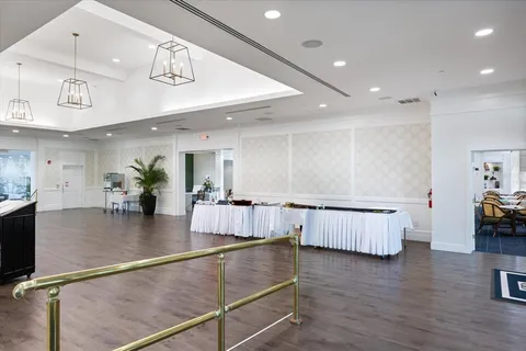 workspace with wooden floor and potted plant