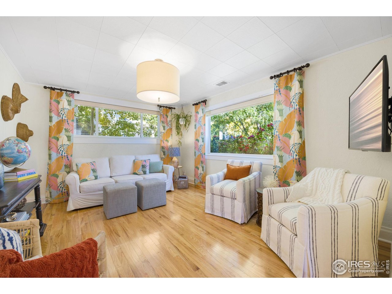 927 5th Street Berthoud, CO 80513 - Photo 12 of 35 a living room with furniture and a large window