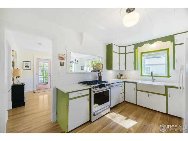 a kitchen with a refrigerator and a sink