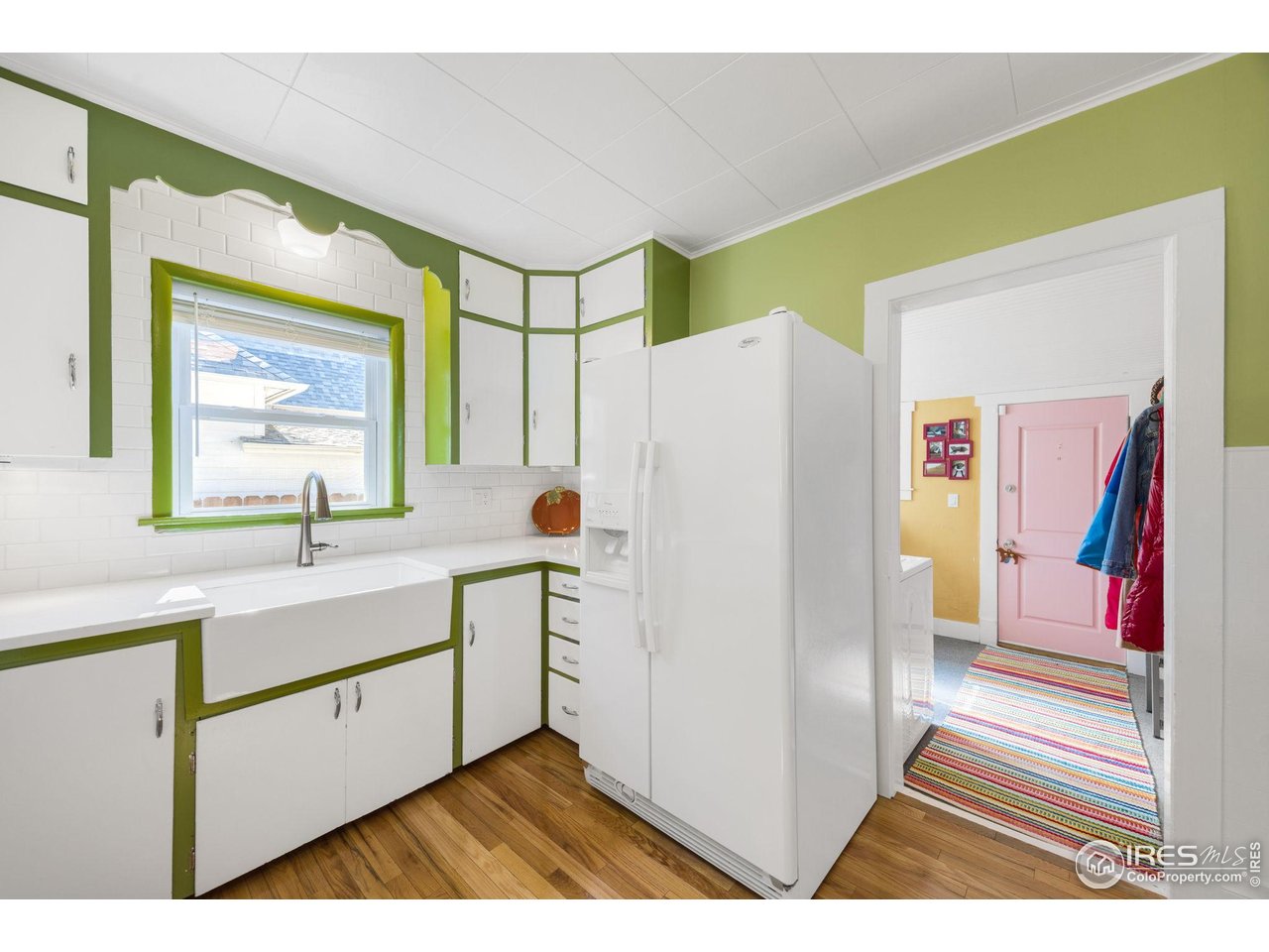 927 5th Street Berthoud, CO 80513 - Photo 16 of 35 a kitchen with a refrigerator and a sink