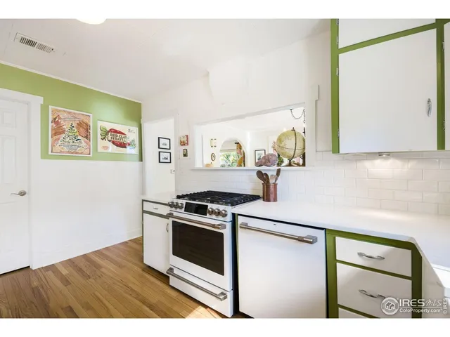 a bathroom with a sink a mirror and a window