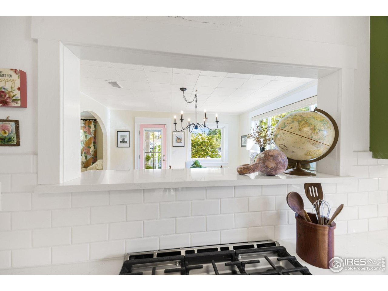 927 5th Street Berthoud, CO 80513 - Photo 18 of 35 a bathroom with a sink a mirror and a window