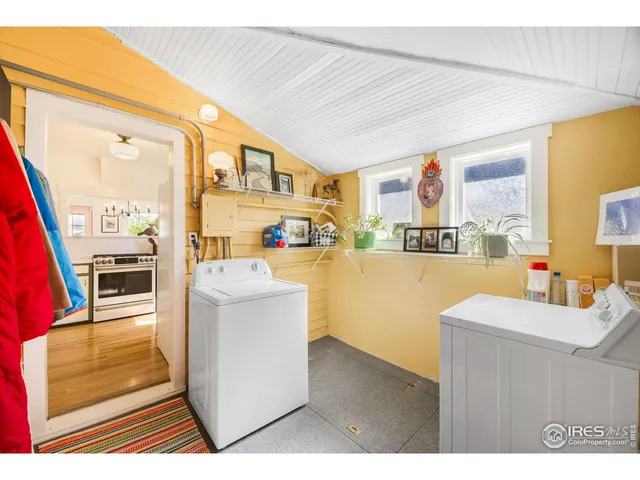 a swimming pool view with a seating space