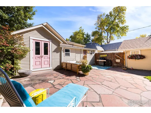 a view of backyard of house with green space