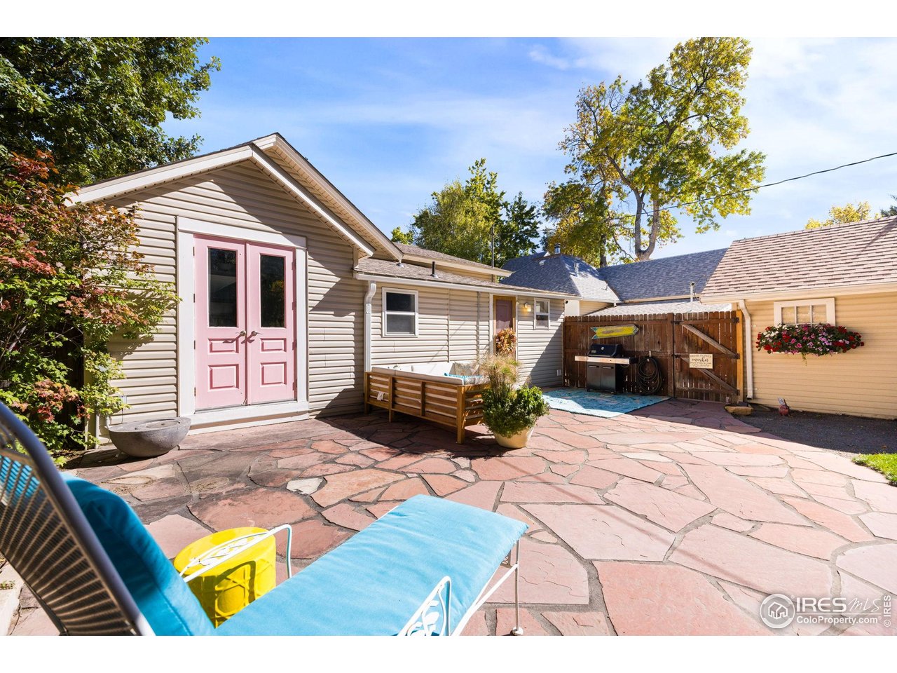 927 5th Street Berthoud, CO 80513 - Photo 29 of 35 a view of a house with a yard
