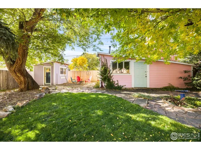 a backyard of a house with barbeque oven