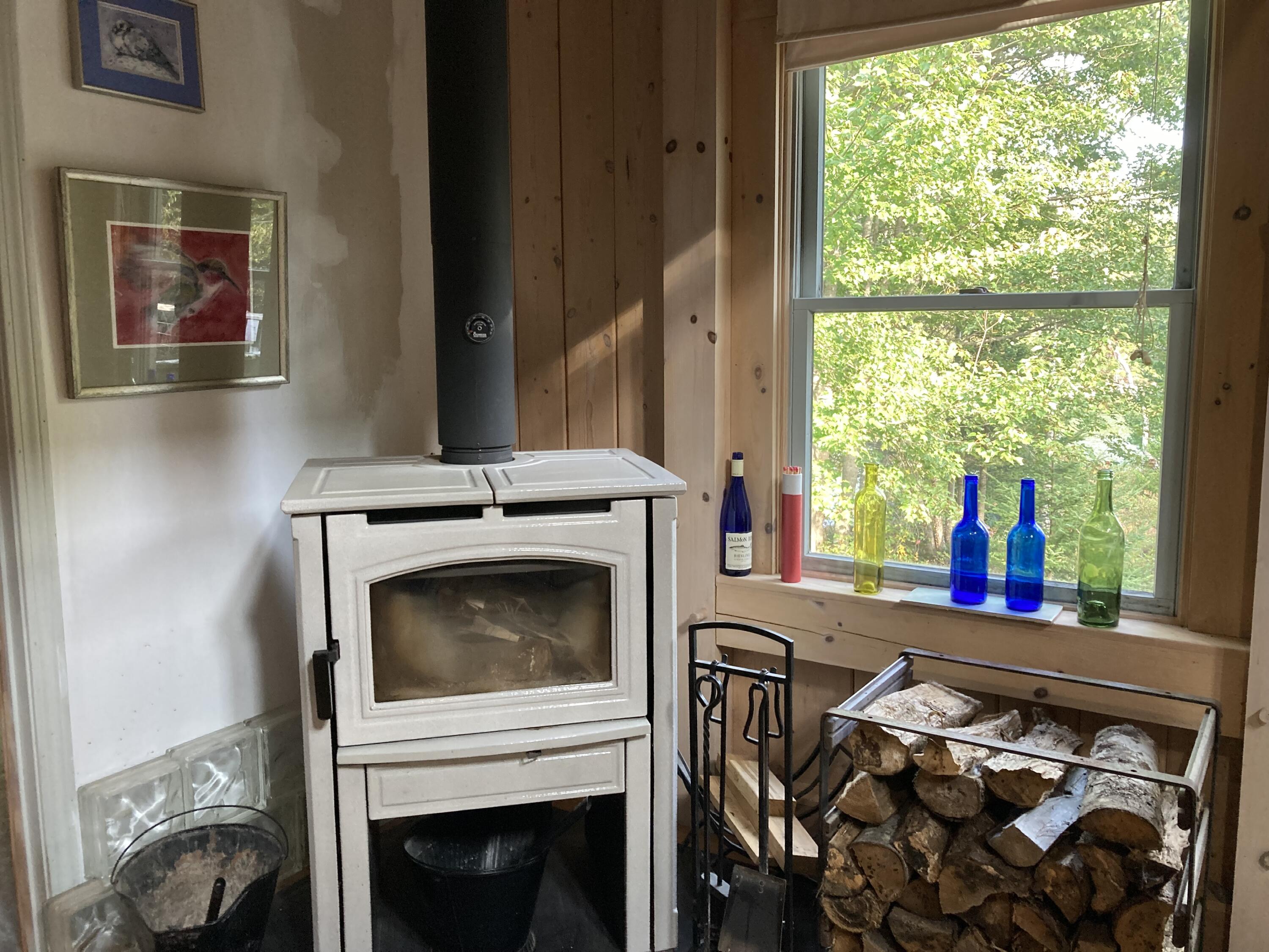 211 Goods Point Road Steuben, ME 04680 - Photo 15 of 20 Swedish, ceramic wood stove.