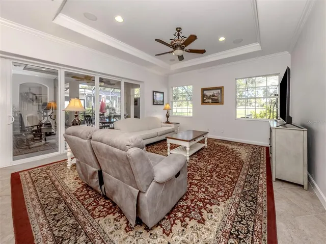 a living room with fireplace furniture and a flat screen tv