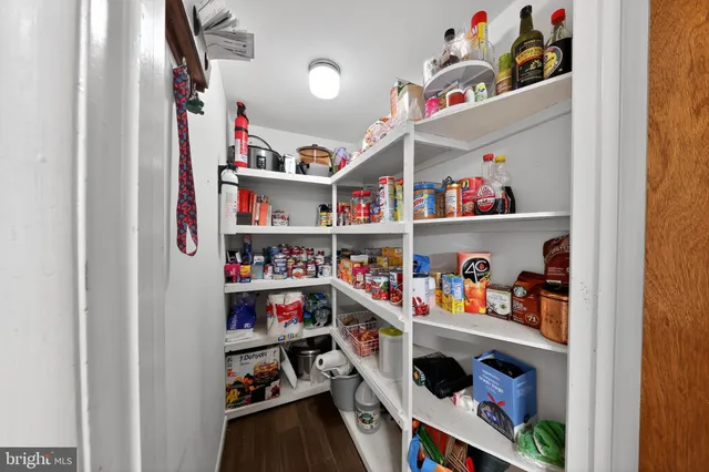 a shelf with books and knick knacks on it