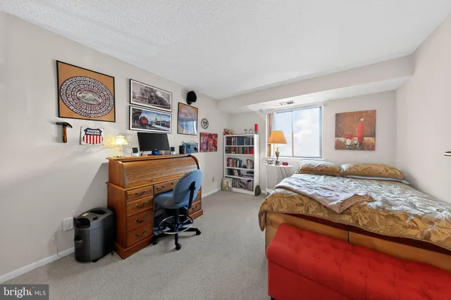 a bedroom with furniture and a bed