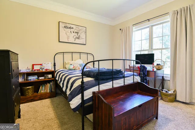a living room with furniture and flat screen tv