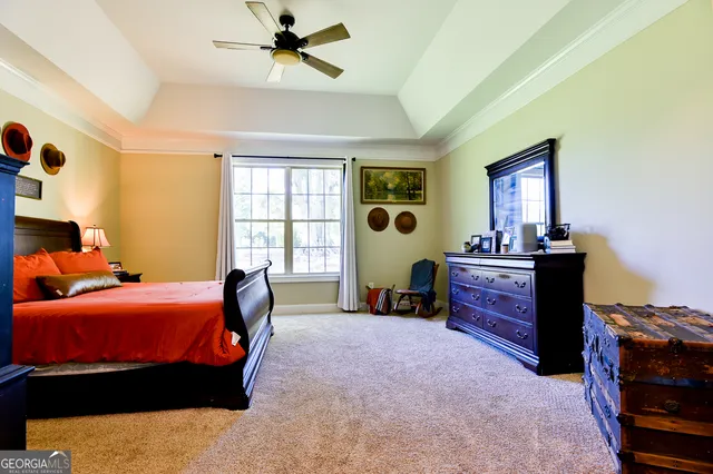 a bedroom with a bed and windows