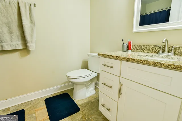 a bathroom with a sink and a toilet
