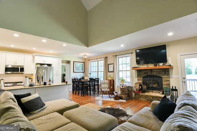 a living room with furniture fireplace and a flat screen tv