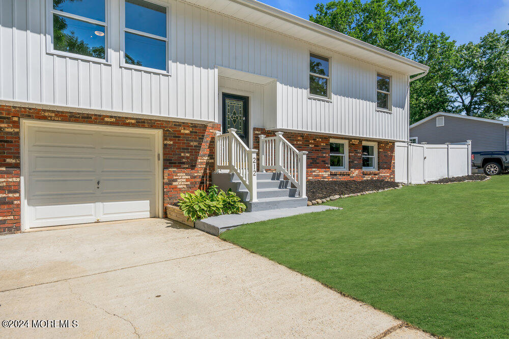 212 Topside Road Manahawkin, NJ 08050 - Photo 1 of 1 a view of a house with a yard