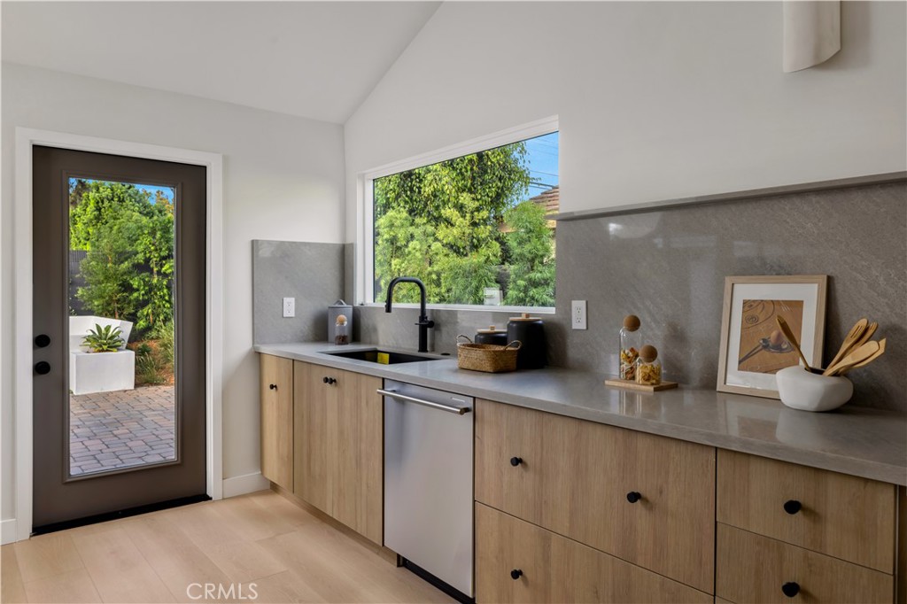 17841 Lucero Way Tustin, CA 92780 - Photo 13 of 39 a kitchen with sink and window