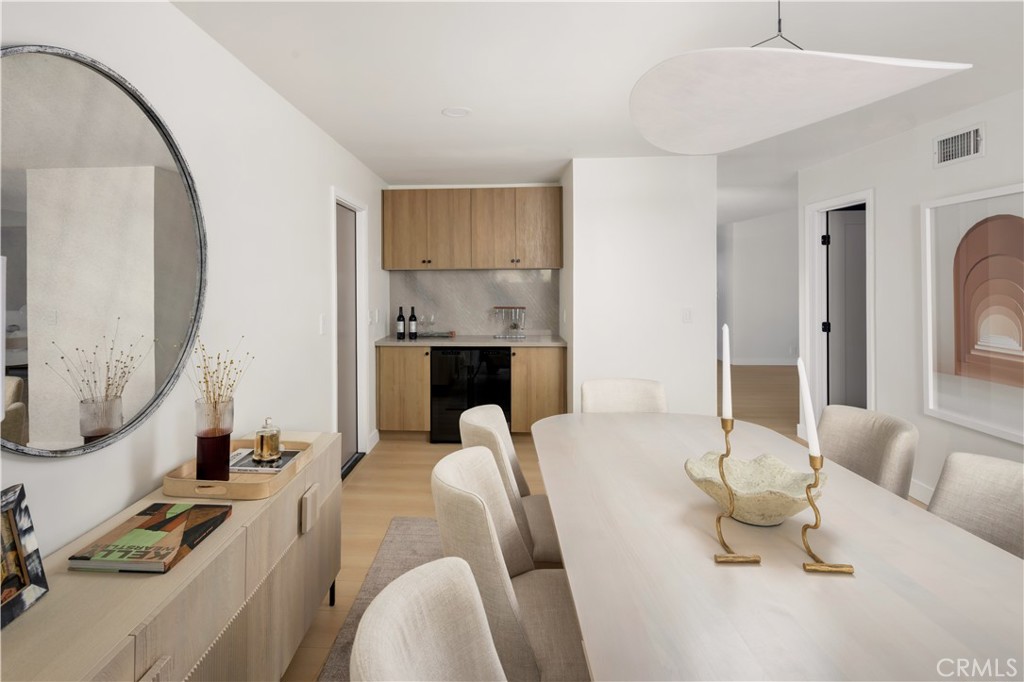 17841 Lucero Way Tustin, CA 92780 - Photo 17 of 39 a living room with furniture a rug and a mirror