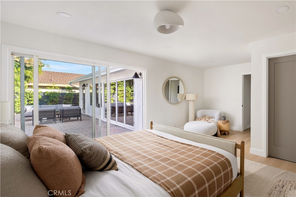 17841 Lucero Way Tustin, CA 92780 - Photo 21 of 39 a bedroom with a large bed and a large window