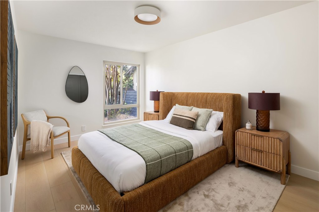 17841 Lucero Way Tustin, CA 92780 - Photo 25 of 39 a bedroom with a bed and a chair