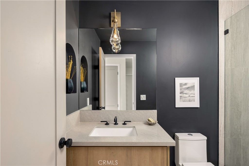 17841 Lucero Way Tustin, CA 92780 - Photo 29 of 39 a bathroom with a sink and a mirror