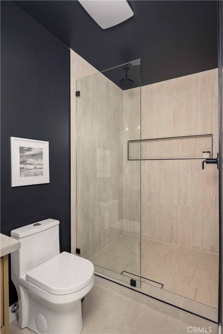 17841 Lucero Way Tustin, CA 92780 - Photo 30 of 39 a bathroom with a shower and toilet