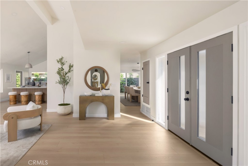 17841 Lucero Way Tustin, CA 92780 - Photo 3 of 39 a view of a livingroom with furniture and a fireplace