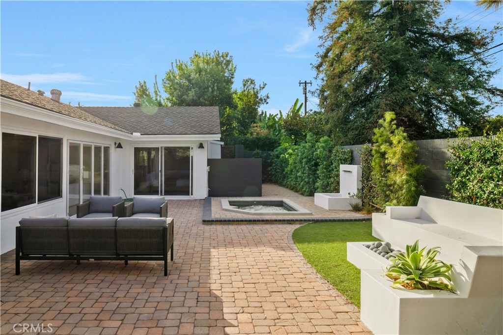 17841 Lucero Way Tustin, CA 92780 - Photo 36 of 39 a view of a patio with couches table and chairs and potted plants