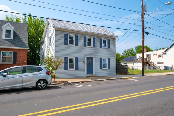 a view of a car parked in front of a house