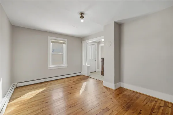 a kitchen with a refrigerator a sink and cabinets