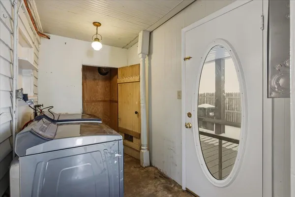 a kitchen with cabinets a refrigerator and a sink