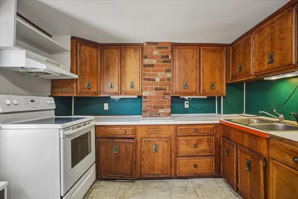 a kitchen with cabinets a sink and dishwasher
