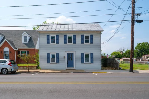 a view of a car parked front of a building