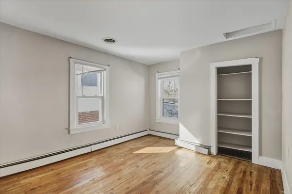 a bathroom with a shower and a sink