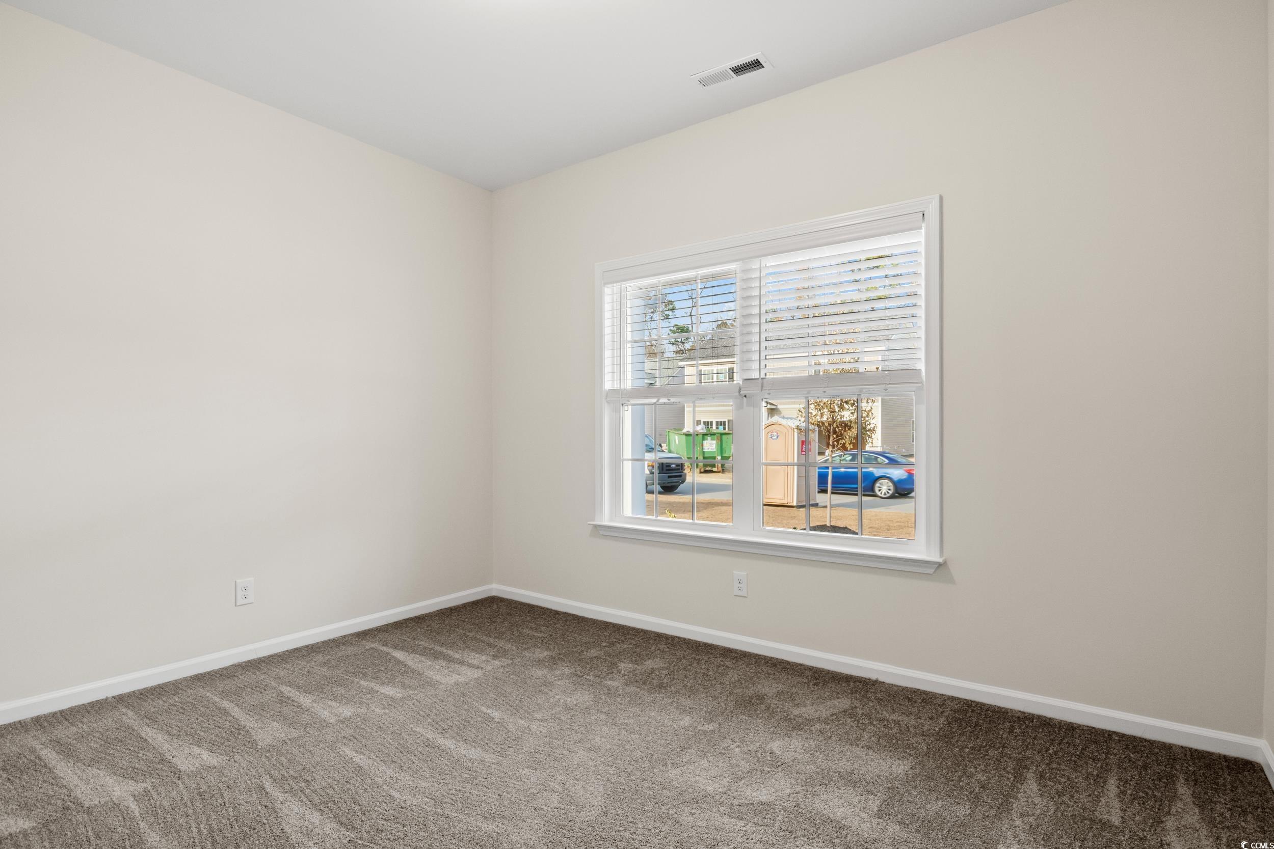 109 Lakota Loop Longs, SC 29568 - Photo 15 of 20 Empty room with carpet floors