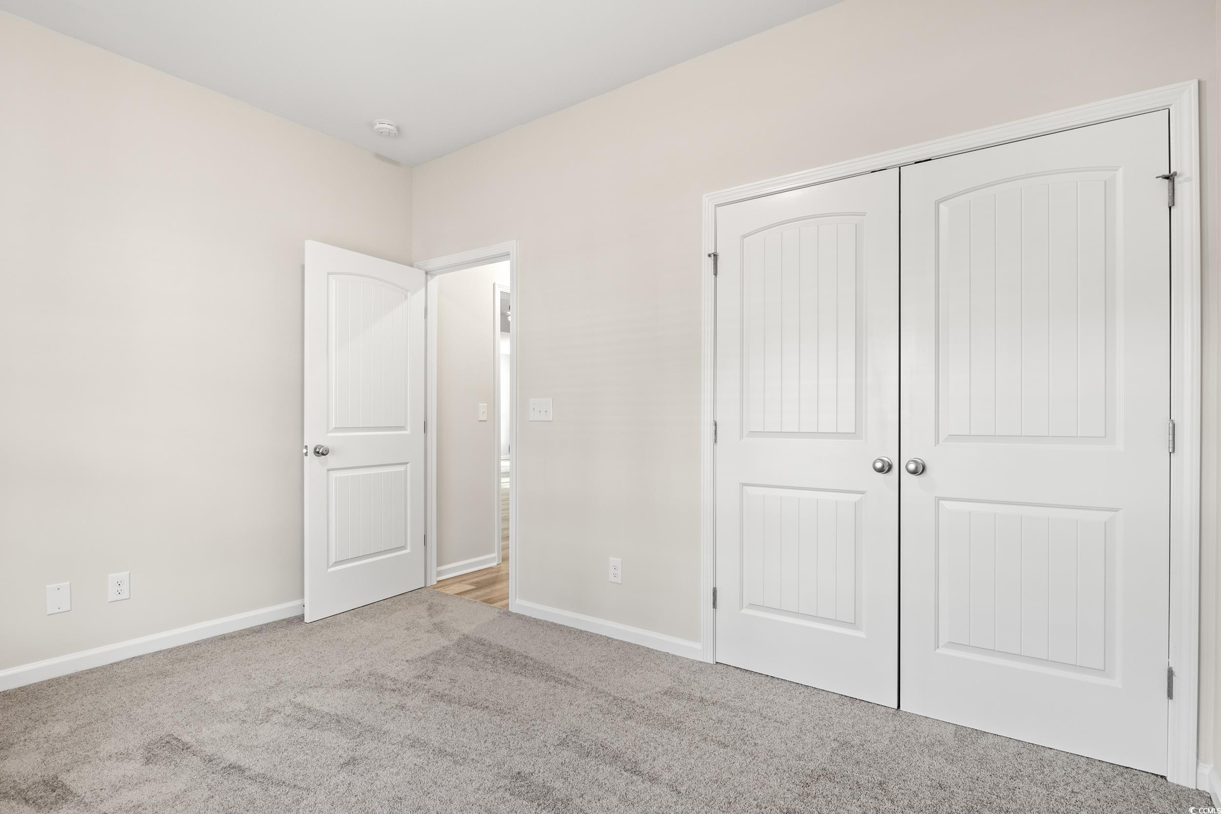 109 Lakota Loop Longs, SC 29568 - Photo 16 of 20 Unfurnished bedroom with light carpet and a closet