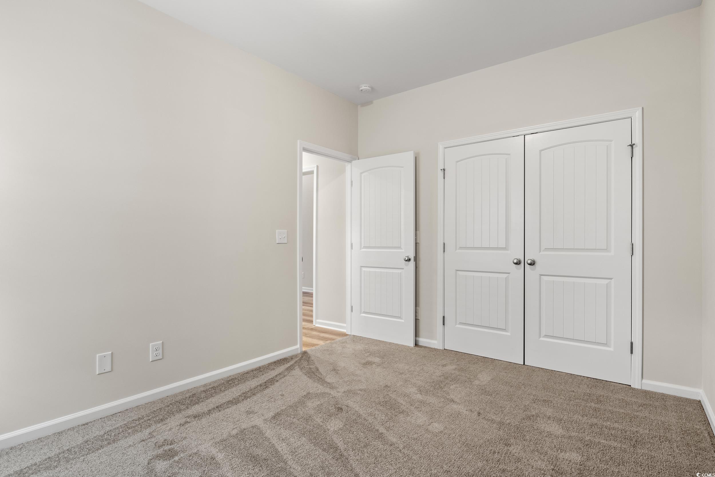 109 Lakota Loop Longs, SC 29568 - Photo 17 of 20 Unfurnished bedroom featuring light colored carpet