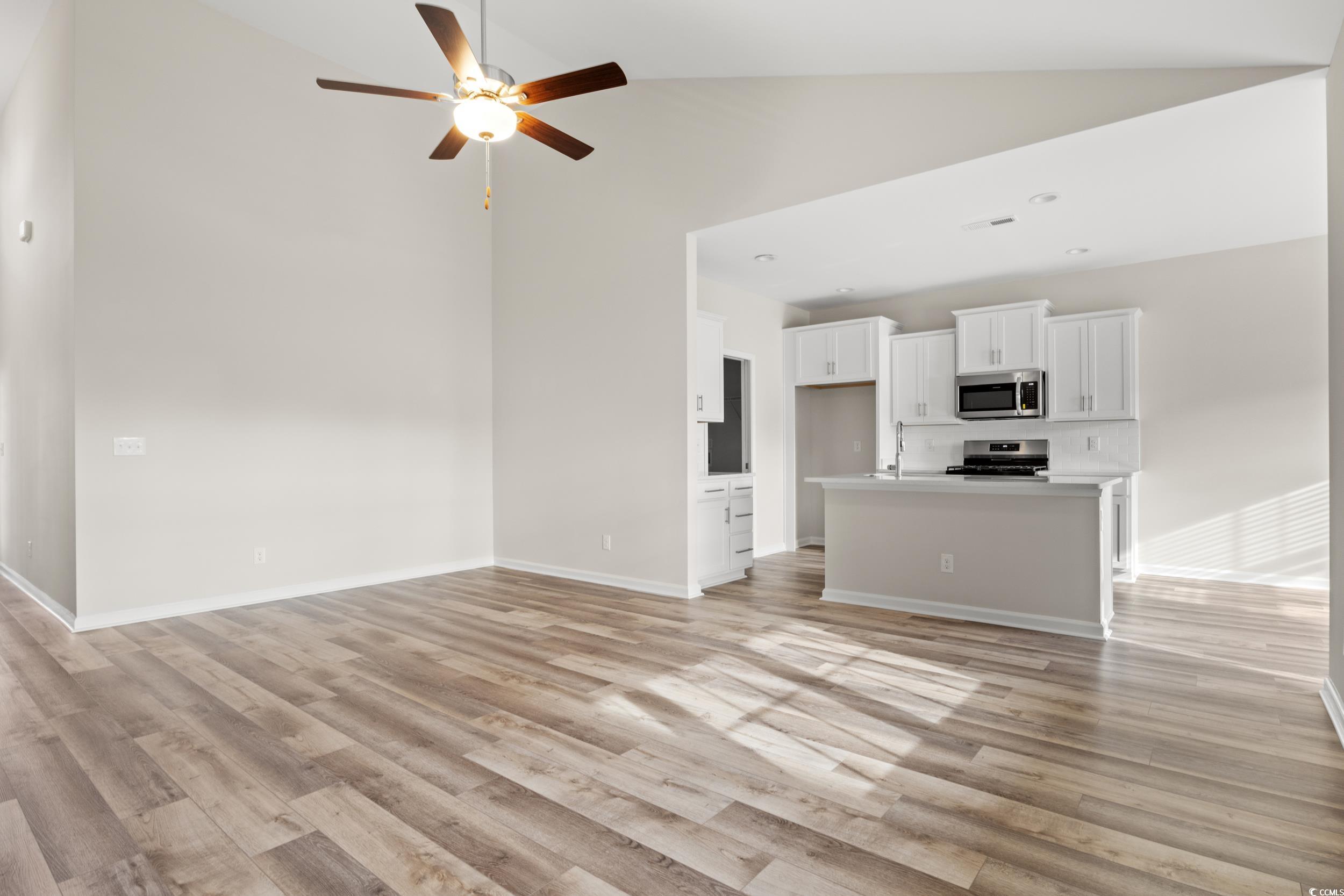 109 Lakota Loop Longs, SC 29568 - Photo 4 of 20 Unfurnished living room with ceiling fan, sink, hi