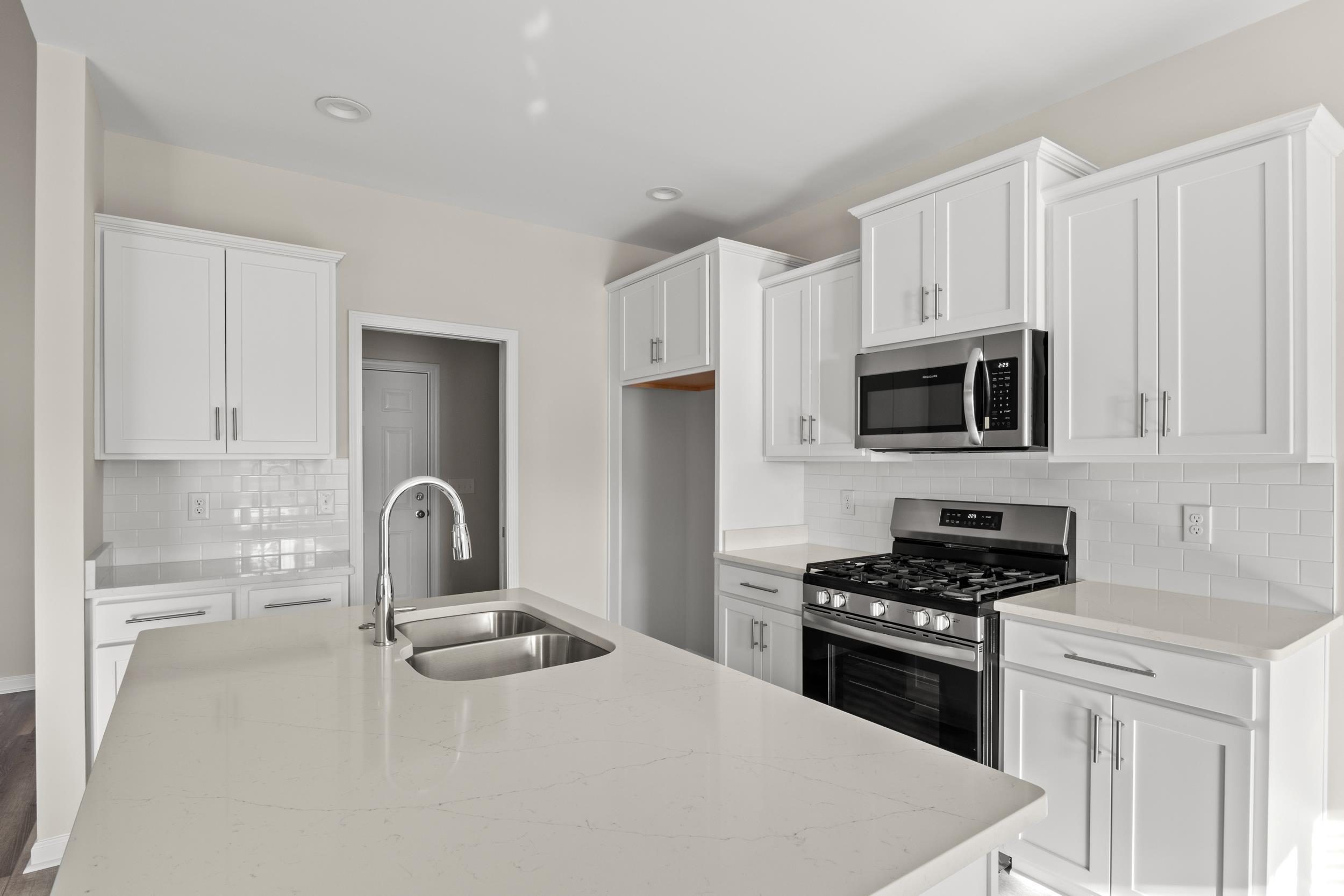 109 Lakota Loop Longs, SC 29568 - Photo 5 of 20 Kitchen featuring light stone countertops, white c