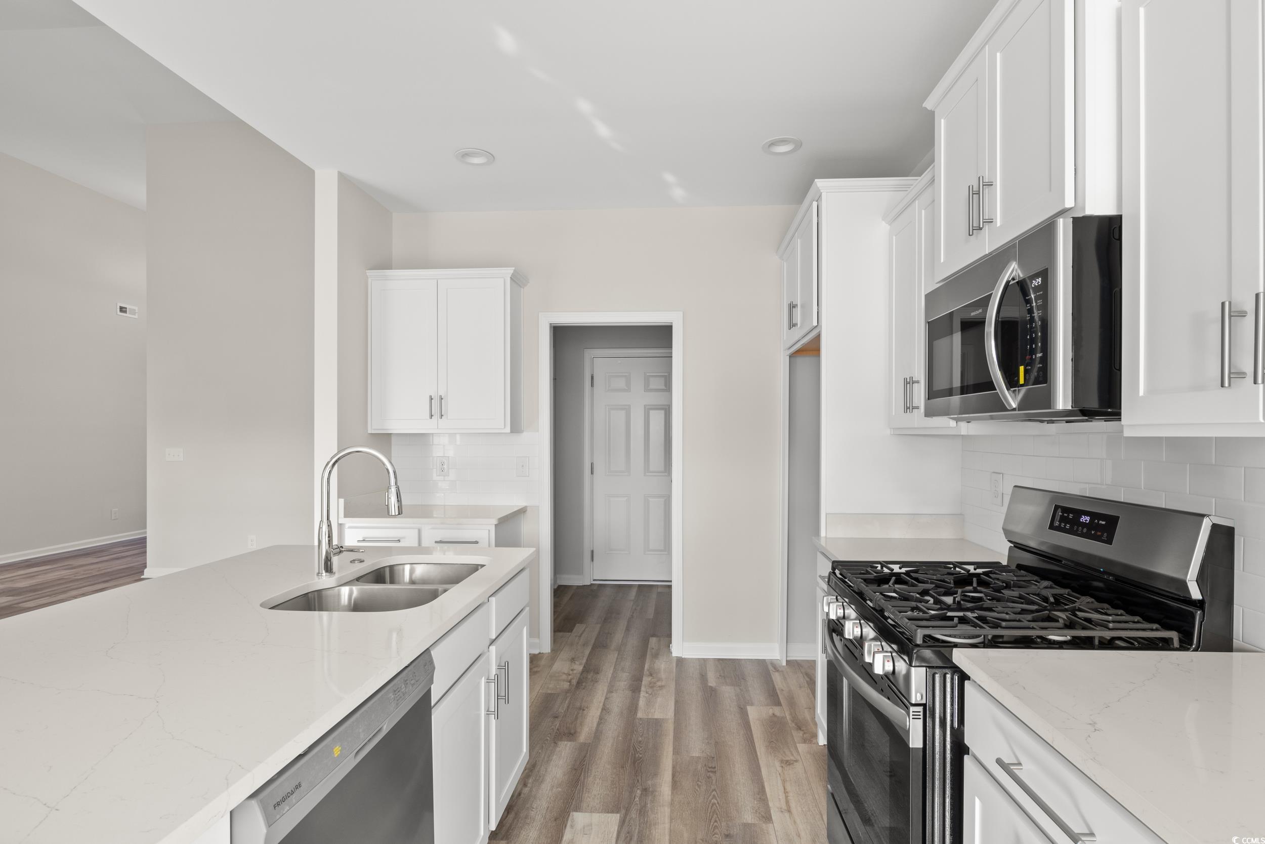 109 Lakota Loop Longs, SC 29568 - Photo 6 of 20 Kitchen with light stone countertops, stainless st