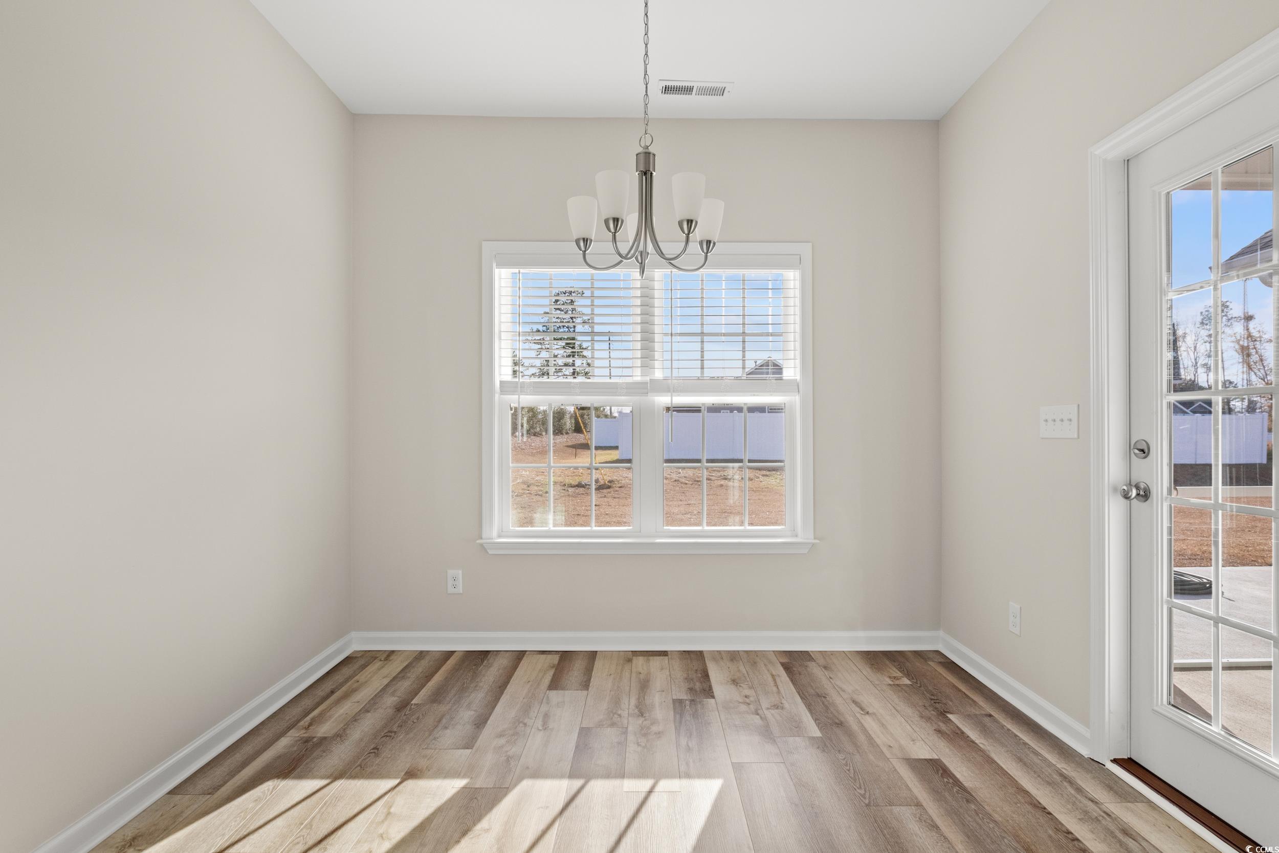109 Lakota Loop Longs, SC 29568 - Photo 7 of 20 Unfurnished dining area featuring a notable chande
